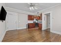 Open-concept living room with hardwood floors and access to a modern kitchen at 733 Frederica Ne St # 7, Atlanta, GA 30306