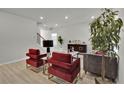 Stylish living room featuring modern furniture, neutral walls, and a cozy atmosphere with a staircase view at 2776 Aralynn Way, College Park, GA 30337