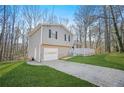 Split level home with a one car garage and ample driveway parking at 3730 N Quail Dr, Douglasville, GA 30135