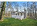 Split level home with large front yard and white lattice porch at 3730 N Quail Dr, Douglasville, GA 30135