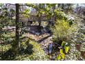 Picturesque backyard with a small stream and wooded surroundings at 2690 Valvedere Dr, Brookhaven, GA 30319