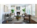 Bright living room with fireplace, stylish furniture, and plenty of natural light at 200 Rivermere Way, Sandy Springs, GA 30350
