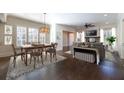 Open-concept with hardwood floors, dining, and living areas, perfect for entertaining and Gathering living at 200 Rivermere Way, Sandy Springs, GA 30350