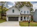 Charming two-story home with a well-manicured lawn and a two-car garage at 2949 Jefferson St, Austell, GA 30106