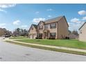 Beautiful two-story home with brick and siding, featuring a well-kept lawn at 3243 Shoals Park Dr, Decatur, GA 30034