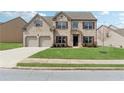 Charming two-story brick home with a well-maintained lawn and mature landscaping at 3243 Shoals Park Dr, Decatur, GA 30034