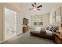 Bedroom with modern fixtures, carpet, en-suite bathroom, television and natural light at 1536 Liberty Nw Pkwy, Atlanta, GA 30318
