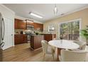 Eat-in kitchen with stainless steel appliances, wooden cabinets, and access to a deck at 1536 Liberty Nw Pkwy, Atlanta, GA 30318