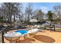 Backyard view featuring a furnished deck with a small pool and grill at 1608 Carroll Nw Dr, Atlanta, GA 30318