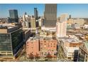 Amazing aerial view showcasing the brick Kessler City Lofts in downtown Atlanta with the skyline in the background at 87 Peachtree Sw St # 204, Atlanta, GA 30303