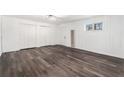 Large living space with fresh paint, vinyl floors, closet, and window at 1496 Greenwillow Dr, Conley, GA 30288