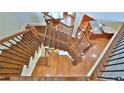 Elegant wooden staircase with wrought iron detailing connecting multiple levels of the home, showcasing craftsmanship at 2650 Riverfront Dr, Snellville, GA 30039