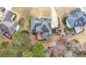 Bird's-eye view of an expansive home with a beautiful backyard and lush green surroundings at 925 Sentry Ridge Xing, Suwanee, GA 30024