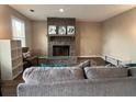 Inviting living room with a stone fireplace and mantle, offering a cozy and stylish atmosphere at 5609 Windwood Rd, Atlanta, GA 30349