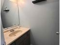 Bathroom featuring a pedestal sink and modern fixtures at 5609 Windwood Rd, Atlanta, GA 30349