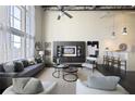 Inviting living room featuring modern decor, high ceilings, and access to a kitchen bar at 572 Edgewood Ne Ave # 301, Atlanta, GA 30312