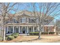 Charming two-story home with a inviting front porch and beautiful landscaping at 114 Rock Creek Ln, Canton, GA 30114