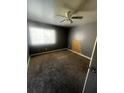 Bedroom with wall to wall carpet, one window, and a ceiling fan at 405 Fairburn Sw Rd, Atlanta, GA 30331