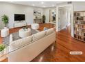 Bright living room boasts hardwood floors and neutral decor at 5676 Kingsport Dr # 4, Atlanta, GA 30342