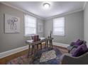 Bright home office with two windows, a modern desk, and two chairs at 1532 Pineview Sw Ter, Atlanta, GA 30311