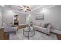 Bright living room with hardwood floors, recessed lighting, and a ceiling fan at 1532 Pineview Sw Ter, Atlanta, GA 30311