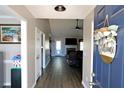 Welcoming foyer with wood floors leading into the living room at 67 Mossy Oak Ln, Dallas, GA 30157