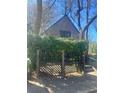 View of a home with lush green foliage offering privacy and charm at 1483 Hardee Ne St, Atlanta, GA 30307