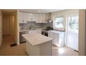 Bright, updated kitchen features stainless steel appliances and quartz countertops at 2422 Clarissa Nw Dr, Atlanta, GA 30318