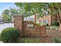 Brick entrance sign for Newport Place surrounded by greenery and showcasing the well-maintained community at 7 Newport Nw Pl, Atlanta, GA 30318