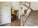 Inviting entryway features hardwood floors, staircase, and view into the formal dining room at 2795 Kakki Ct, Marietta, GA 30062