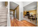 Inviting foyer with hardwood floors, staircase, and glimpses of the living room and kitchen at 3999 Craggy Perch, Douglasville, GA 30135