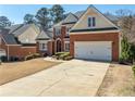 Beautiful brick home with a two-car garage, well-maintained landscaping, and a neatly paved driveway at 2986 Nestle Creek Dr, Marietta, GA 30062