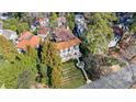 Aerial view of the estate showcasing lush landscaping and a grand home with a tile roof at 388 Beverly Ne Rd, Atlanta, GA 30309