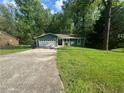 Charming single-story home featuring an attached garage and a well-maintained lawn at 815 Oxford Hall Dr, Lawrenceville, GA 30044
