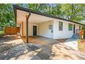Attached carport featuring wooden support beams and dark hardware on the freshly painted exterior at 3113 Bellgreen Way, Decatur, GA 30032