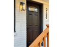 Close-up of a stylish front door with a modern light fixture at 3113 Bellgreen Way, Decatur, GA 30032
