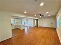 Spacious living room with hardwood floors that opens to the kitchen at 3113 Bellgreen Way, Decatur, GA 30032