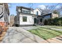 Two-story home with modern design, landscaped yard, and contemporary driveway at 904 Kings Ne Ct, Atlanta, GA 30306