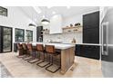 Gourmet kitchen features a large island with bar seating and custom cabinetry at 904 Kings Ne Ct, Atlanta, GA 30306
