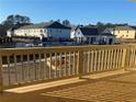 View of the community pool and surrounding buildings from the wooden deck at 3352 Cranston Ln, Kennesaw, GA 30144