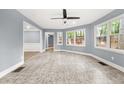 Inviting sunroom featuring large windows and ample natural light at 3900 Millwood Lane Nw, Lilburn, GA 30047