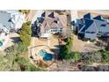 Aerial view of the backyard, showcasing a private in-ground pool and deck with lush landscaping at 4978 Millwood Dr, Canton, GA 30114