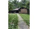 Expansive backyard with a walkway leading to the charming cedar-shake home at 1954 Oak Grove Ne Rd, Atlanta, GA 30345