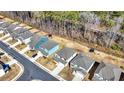 An aerial view of a residential neighborhood featuring modern homes and well-maintained landscaping at 325 Caledonia Court Ct, Peachtree City, GA 30269