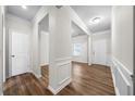 Open entryway with beautiful wood floors, white trim and doors, and a view into adjacent rooms at 72 Summer Nw Pl, Cartersville, GA 30121