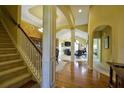 Spacious foyer with hardwood floors and elegant staircase leading to the upper level at 352 Lauren Ln, Woodstock, GA 30188