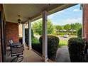 Charming front porch with seating area overlooking a well-manicured lawn at 352 Lauren Ln, Woodstock, GA 30188