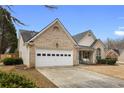 Beautiful home boasts a well-manicured lawn and inviting front porch with swing at 4037 Mcpherson Dr, Acworth, GA 30101