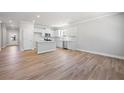 Modern kitchen featuring white cabinets, stainless steel appliances, and an island at 147 Park Lane Ln, Fairburn, GA 30213