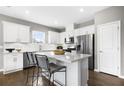 Modern kitchen featuring stainless steel appliances and white cabinetry at 159 Park Lane Ln, Fairburn, GA 30213